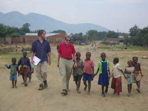 Wren and I in Uganda with LIDEFO (and lots of kids)